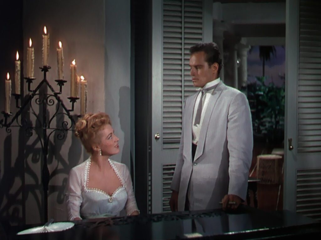 The Naked Jungle - Byron Haskin - Eleanor Parker - Charlton Heston - Joanna Leiningen - Christopher Leiningen - piano - candelabra - plantation house