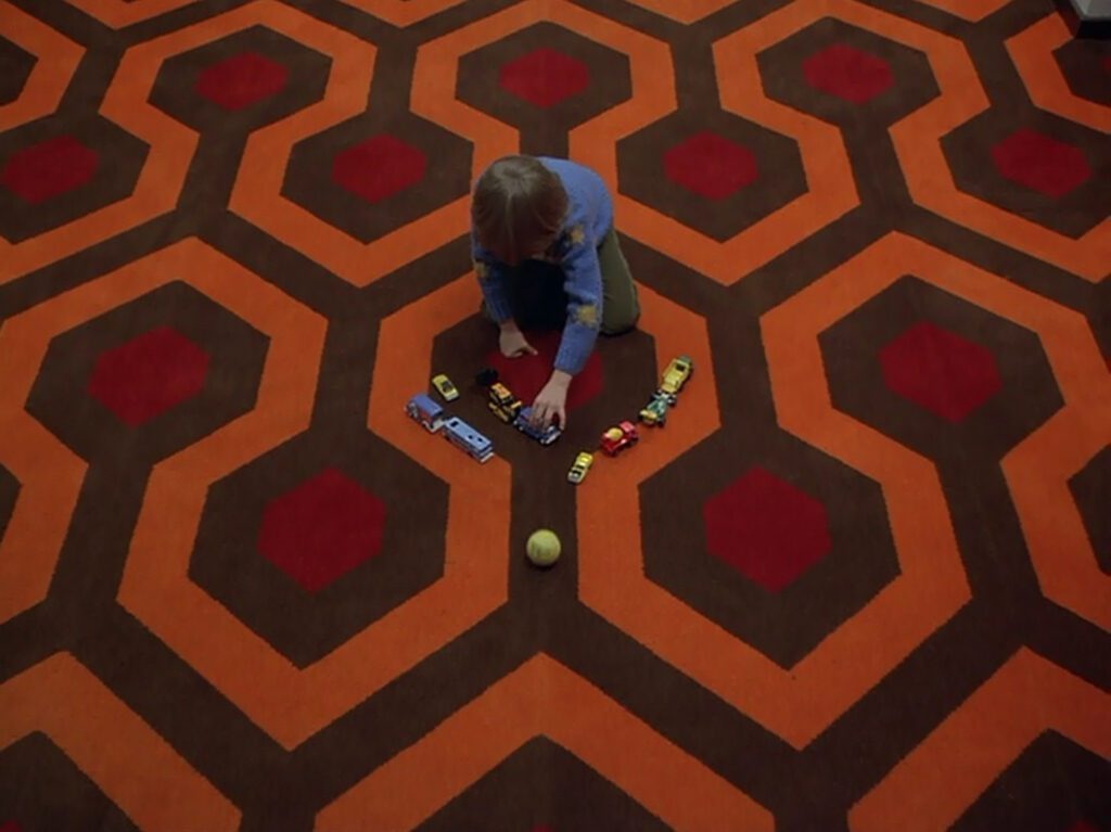 The Shining - Stanley Kubrick - Danny Lloyd - Danny Torrance - Overlook Hotel - carpet - cars - ball - pattern