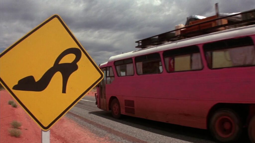 The Adventures of Priscilla Queen of the Desert - Stephan Elliott - bus - highway - high heeled shoe - road sign