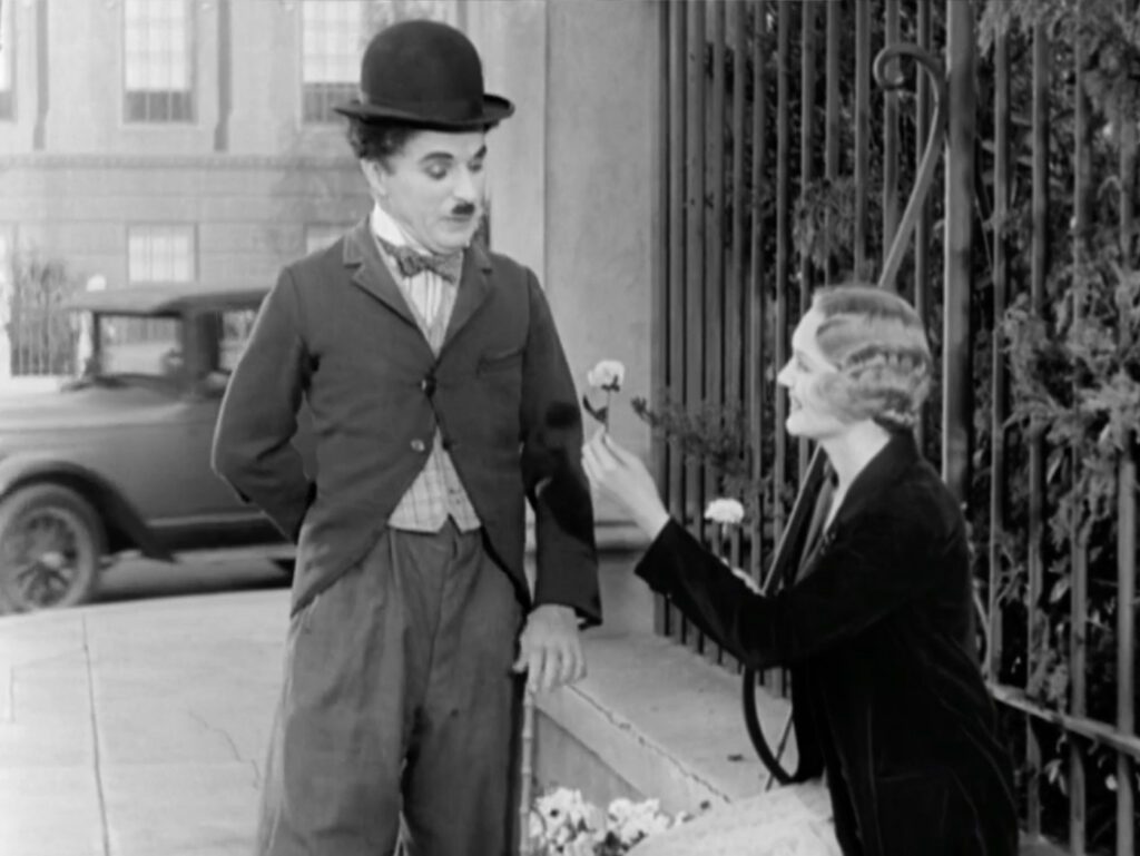 City Lights - Charles Chaplin - Virginia Cherrill - Little Tramp - Blind Girl - flowers