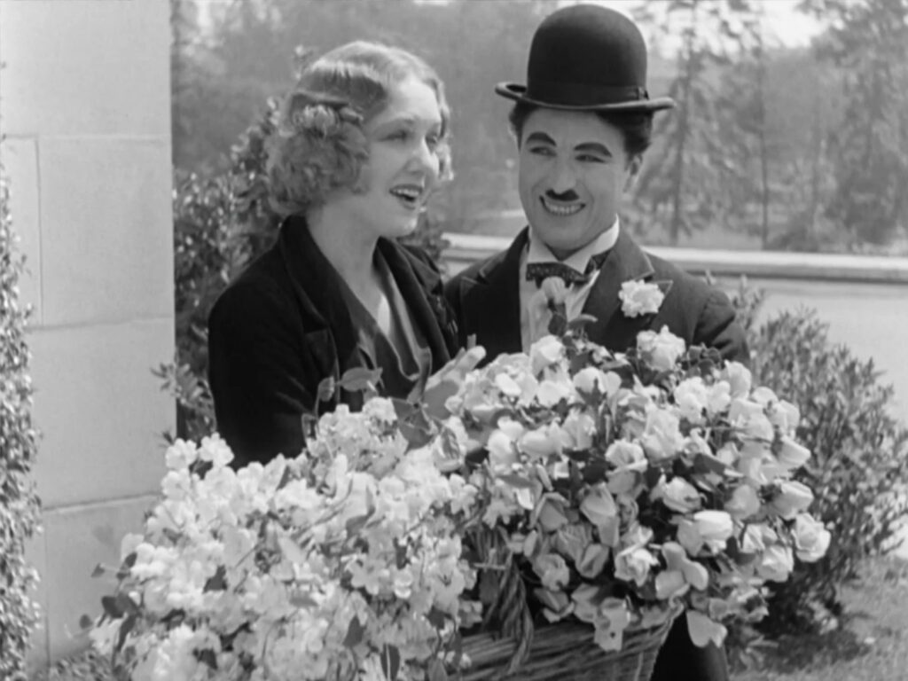 City Lights - Charles Chaplin - Virginia Cherrill - Blind Girl - Little Tramp - flowers
