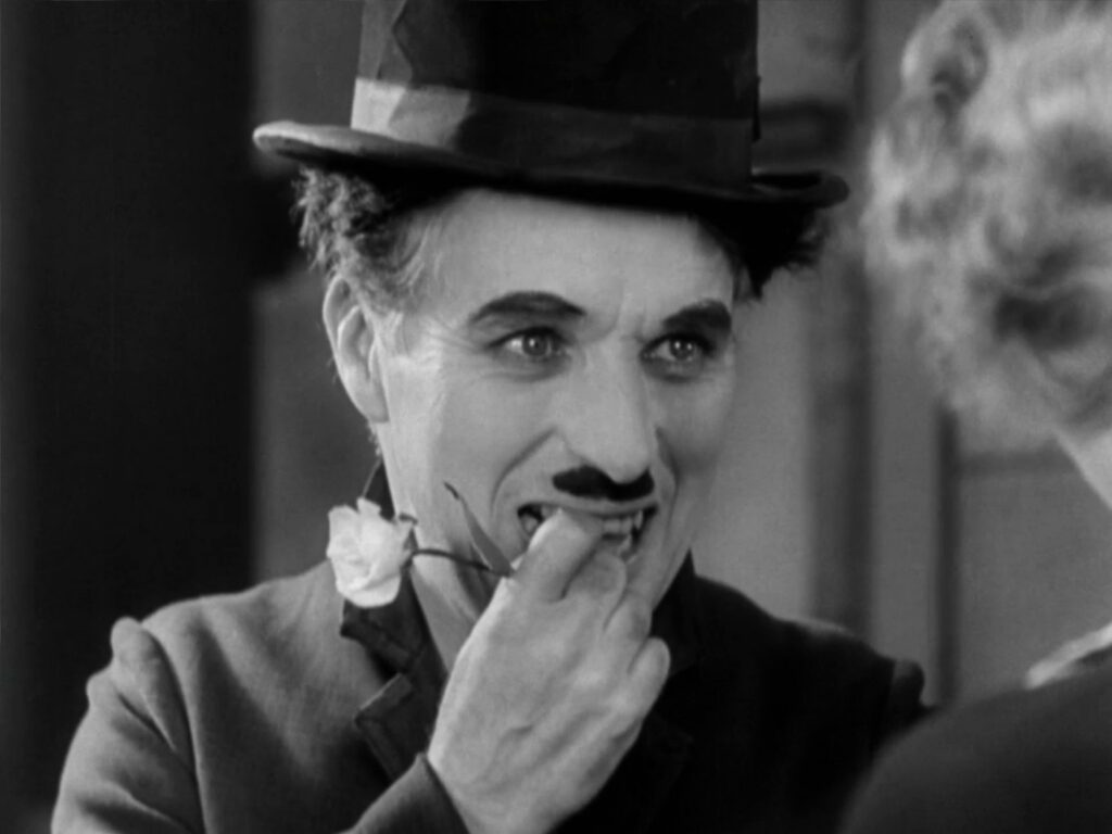 City Lights - Charles Chaplin - Little Tramp - ending - close-up - flower