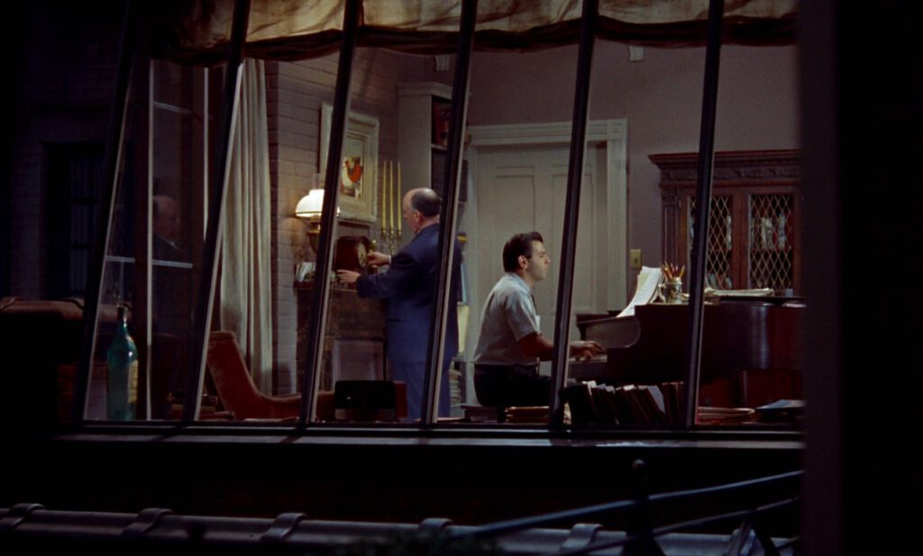 Rear Window - Alfred Hitchcock - director cameo - piano - pianist - songwriter - winding a clock