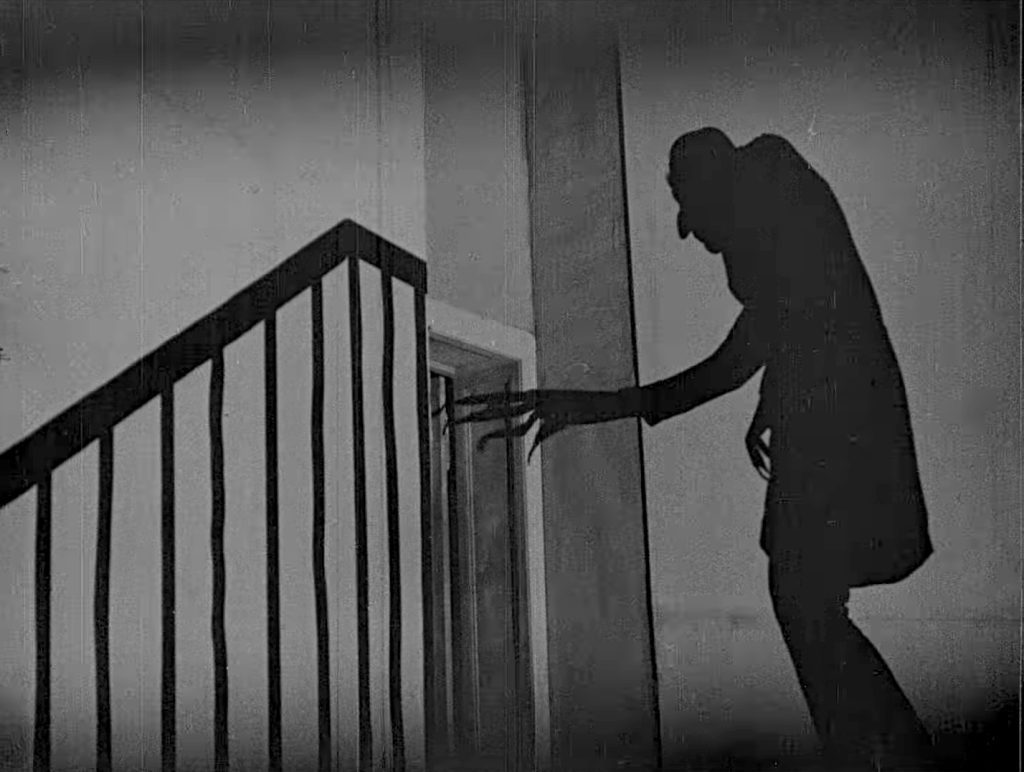 nosferatu-a-symphony-of-horror-1-27-05 Nosferatu a Symphony of Horror - Nosferatu eine Symphonie des Grauens - Friedrich Wilhelm Murnau - Max Schreck - Count Orlok - shadow - staircase - door